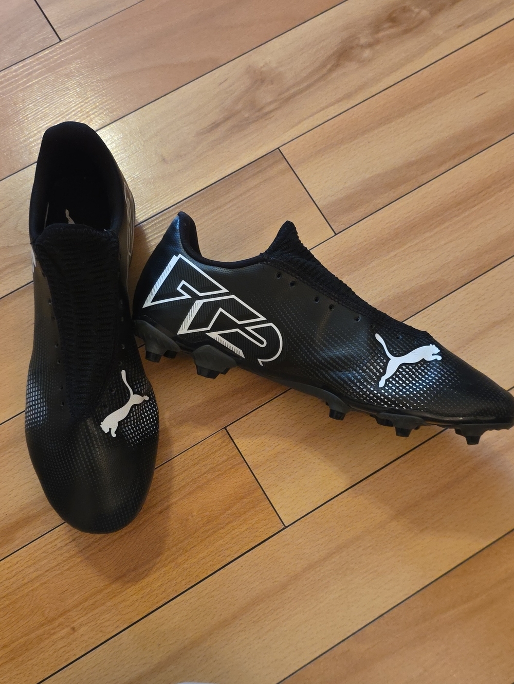Puma Black Soccer Cleats with White Logos